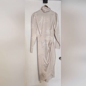 Fashion Nova. Size SM. Open back, high neck, long sleeve,cream dress. Rose print